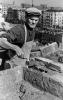 Знатный мастер-каменщик 7-го разряда строительного треста №1 Главминстроя Д.Г.Булахов на строительстве жилого дома. Сентябрь 1950 года. 