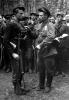 1943 г. Пинщина. Комиссар партизанского отряда Ф.И.Лисович (справа) вручает медаль партизану-разведчику комсомольцу Николаю Кулакевичу